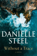 Sharp rocky cliffs meet cerulean blue waters in a white foamed wave. Danielle Steels name is in big white letters and the title "Without a Trace" is in smaller white letters both at the bottom of the cover.
