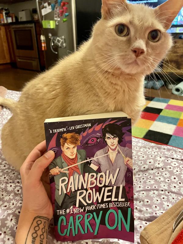 Cat and the book Carry On by Rainbow Rowell