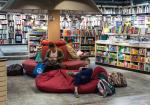 Patrons sitting in beanbag chairs in a library